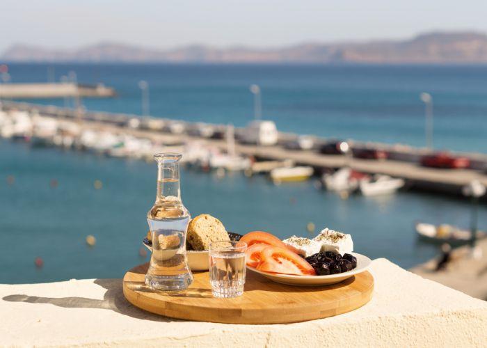 raki and snacks Veniamakis Stefanos shutterstock