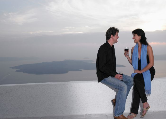 couple toasting santorini