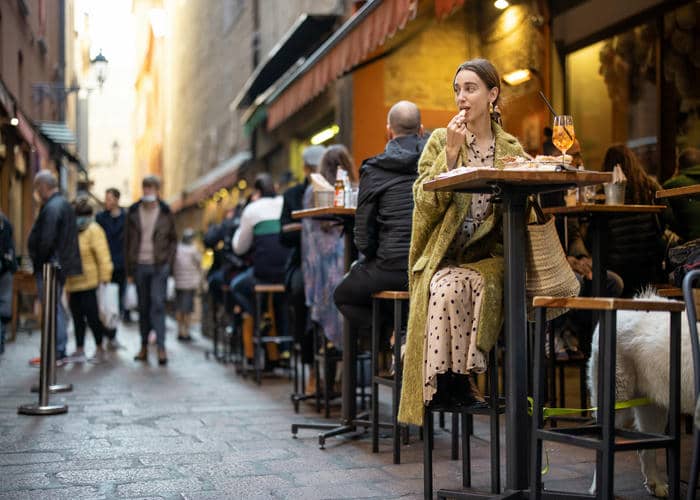woman eating in bologna