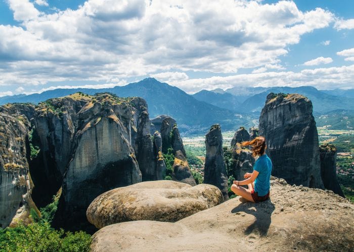 girl meditating in meteora