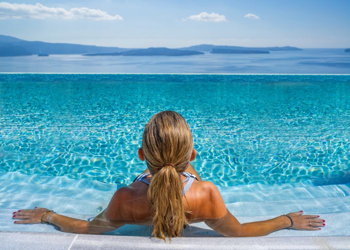 pool santorini caldera Netfalls Remy Musser shutterstock