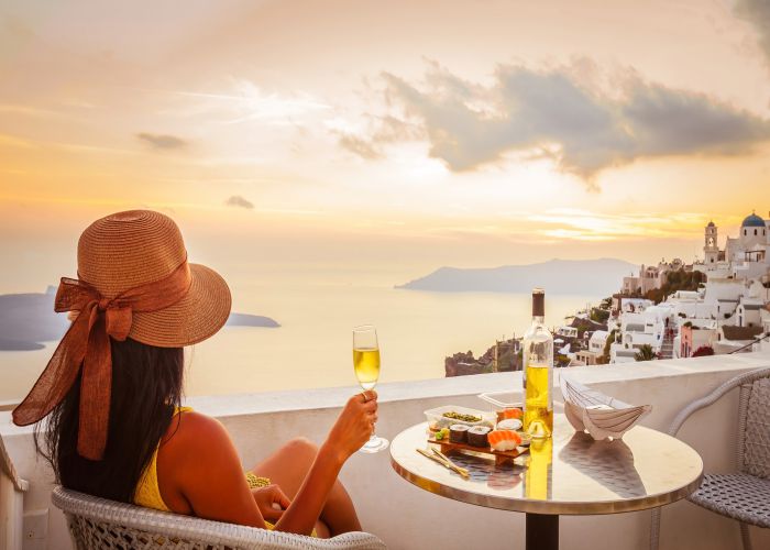 santorini lady sunset Littleaom shutterstock